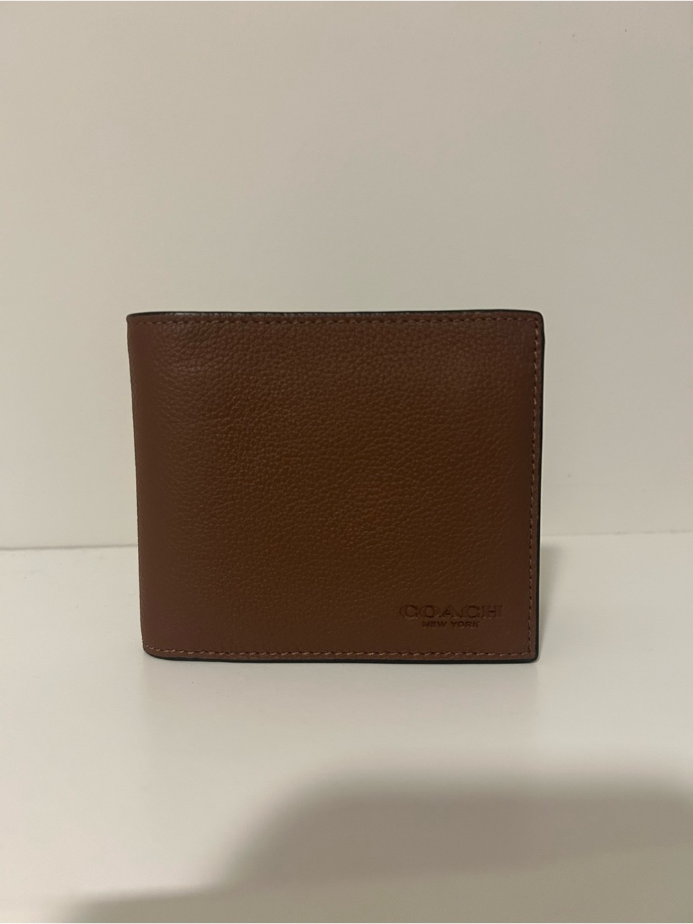 Coach Brown Leather Bifold Wallet with Embossed Logo